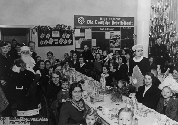 Christmas Celebration at Mercedes-Benz, with German Labor Front Bulletin Board in the Background (1938)